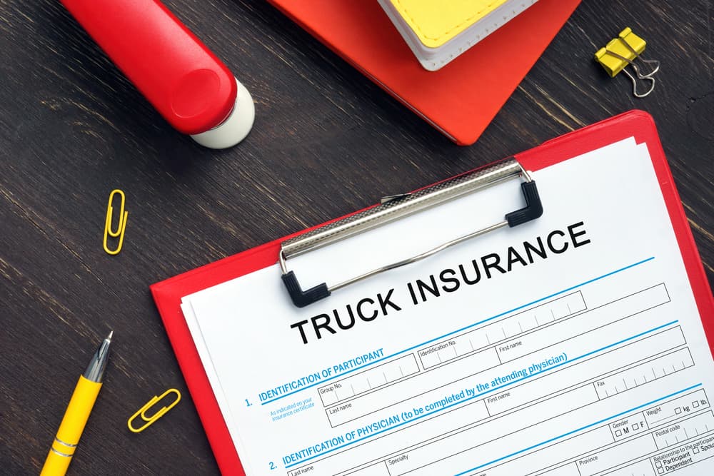 TRUCK INSURANCE Application Form with phrase on the business paper