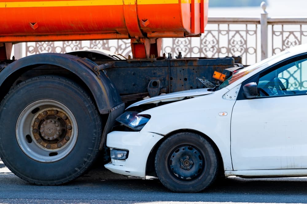 A underride collision between a car and truck