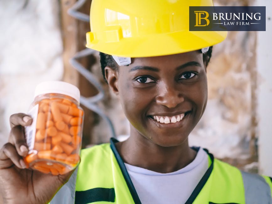 Worker in safety gear representing workplace protection and workers compensation benefits