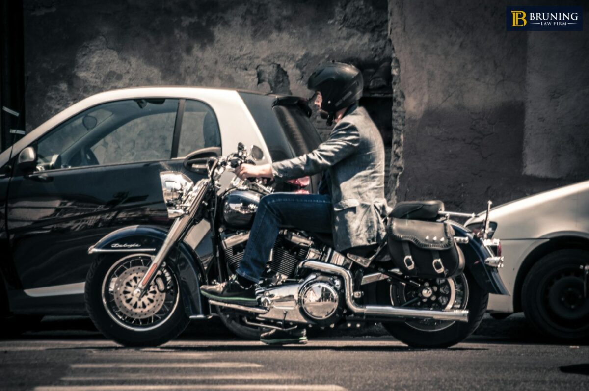 Motorcycle rider navigating traffic illustrating shared fault in motorcycle accidents