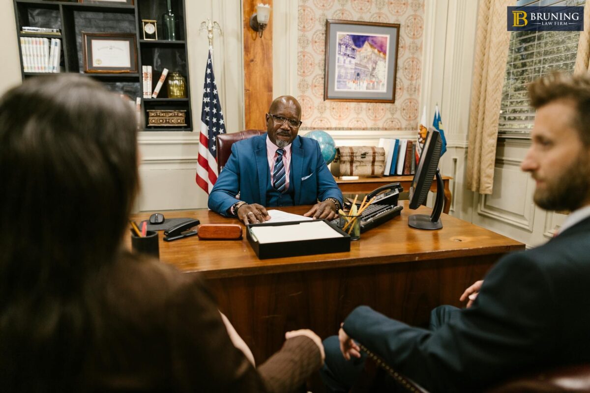Personal injury lawyer discussing costs and fees during a client consultation