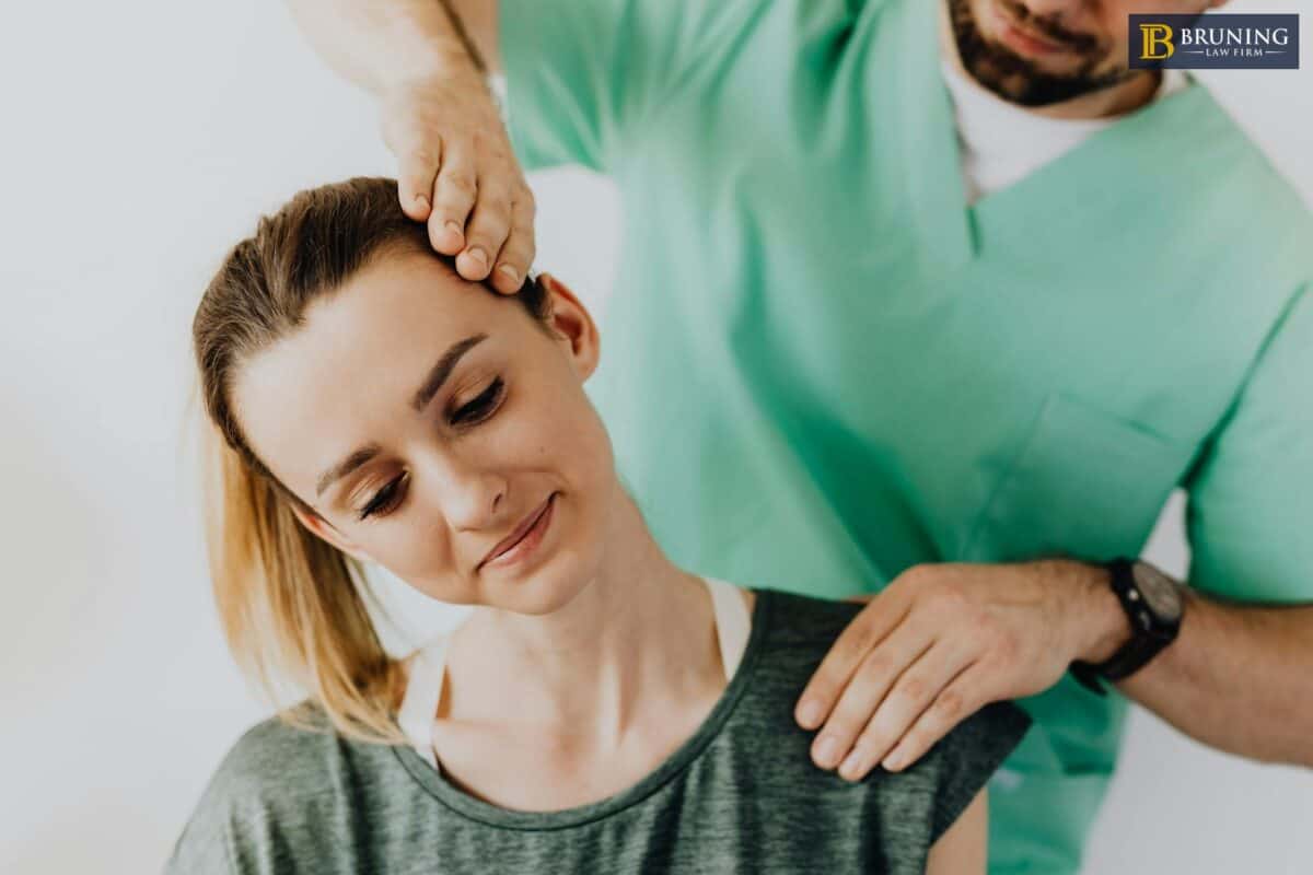 Person experiencing neck and back soreness after a car accident during recovery